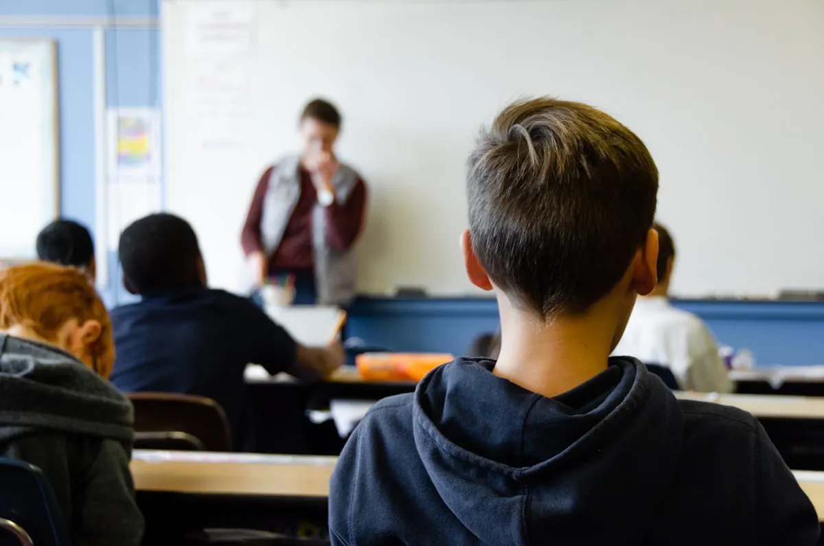 A high-school student at a desk